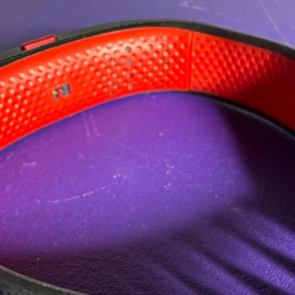 Under Armour htc Activity Tracker wrist band. Black and red, untested.